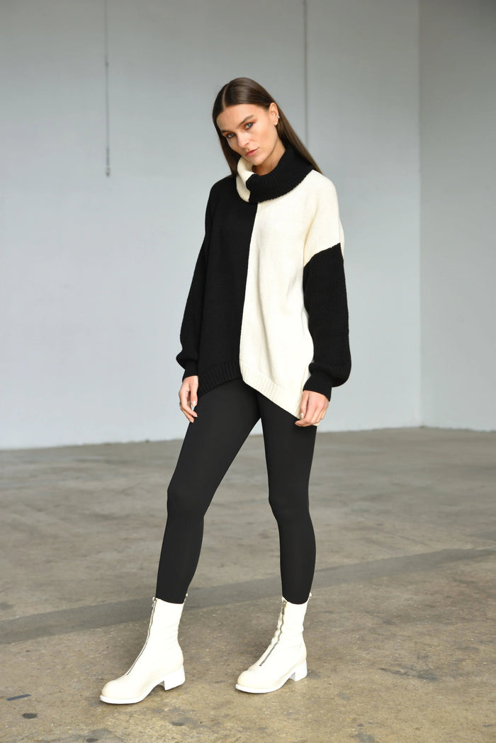 Simply Mila Ying Yan sweater, modern women's clothing, featuring soft knit fabric and stylish design in a close-up view.