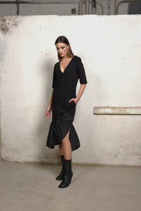 Simply Mila women's sweater dress with ruffle details, featuring an unbalanced design in a stylish, modern silhouette.