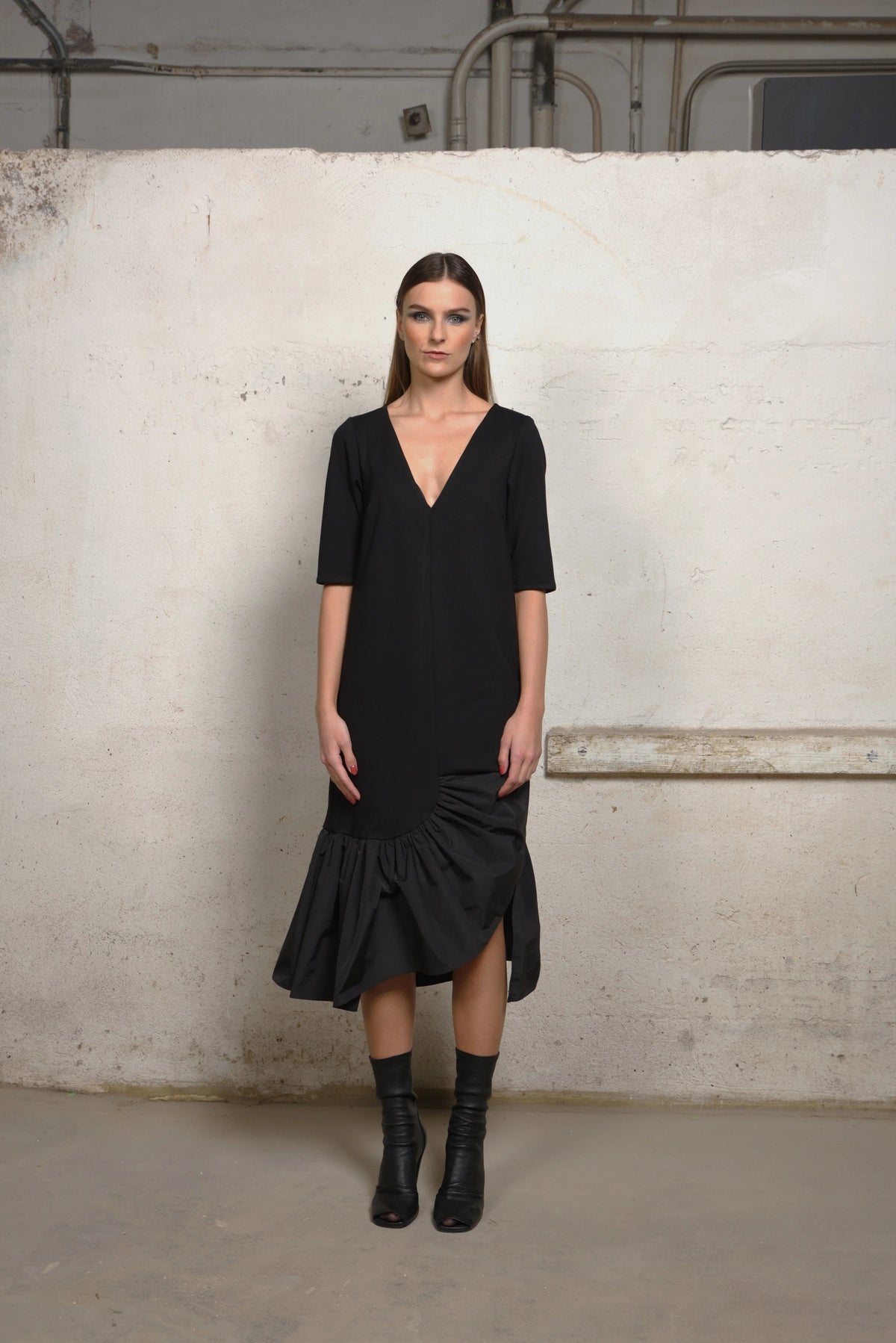 Simply Mila unbalance ruffle sweater dress, modern women's clothing, front view showcasing ruffle details and cozy fit.