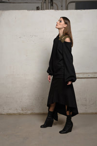 Asymmetrical beige sweater by SIMPLY MILA, modern women's jumper with a stylish uneven hem and cozy knit fabric.