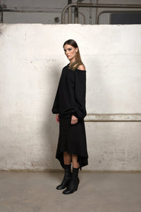 Asymmetrical sweater by Simply Mila, modern women's clothing, featuring a stylish asymmetric design and soft knit fabric.