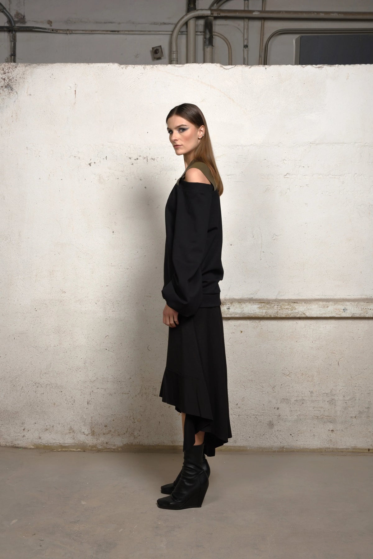 Stylish asymmetrical sweater by SIMPLY MILA, modern women's clothing, featuring a unique cut and cozy knit fabric.