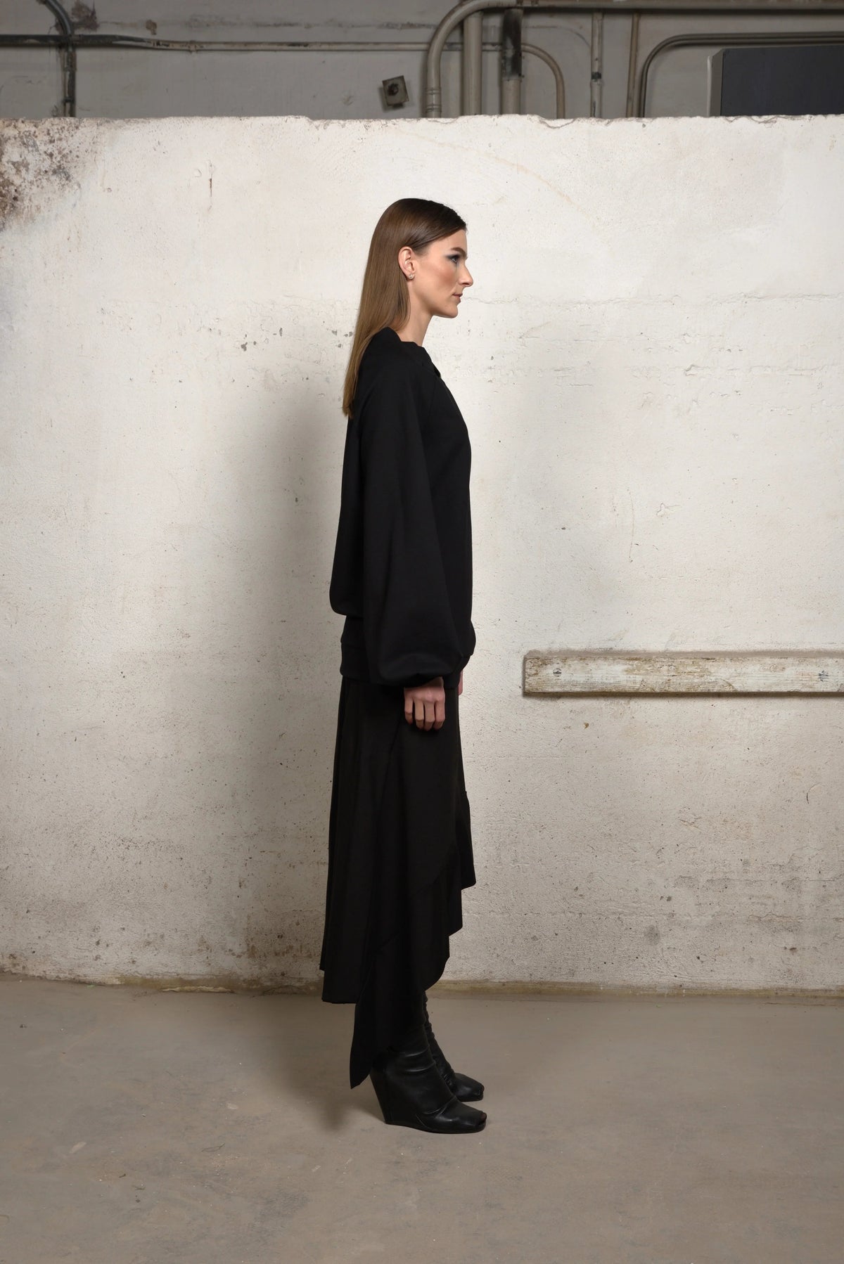 Asymmetrical sweater from Simply Mila, modern women's clothing, with a stylish irregular hem and cozy knit fabric.