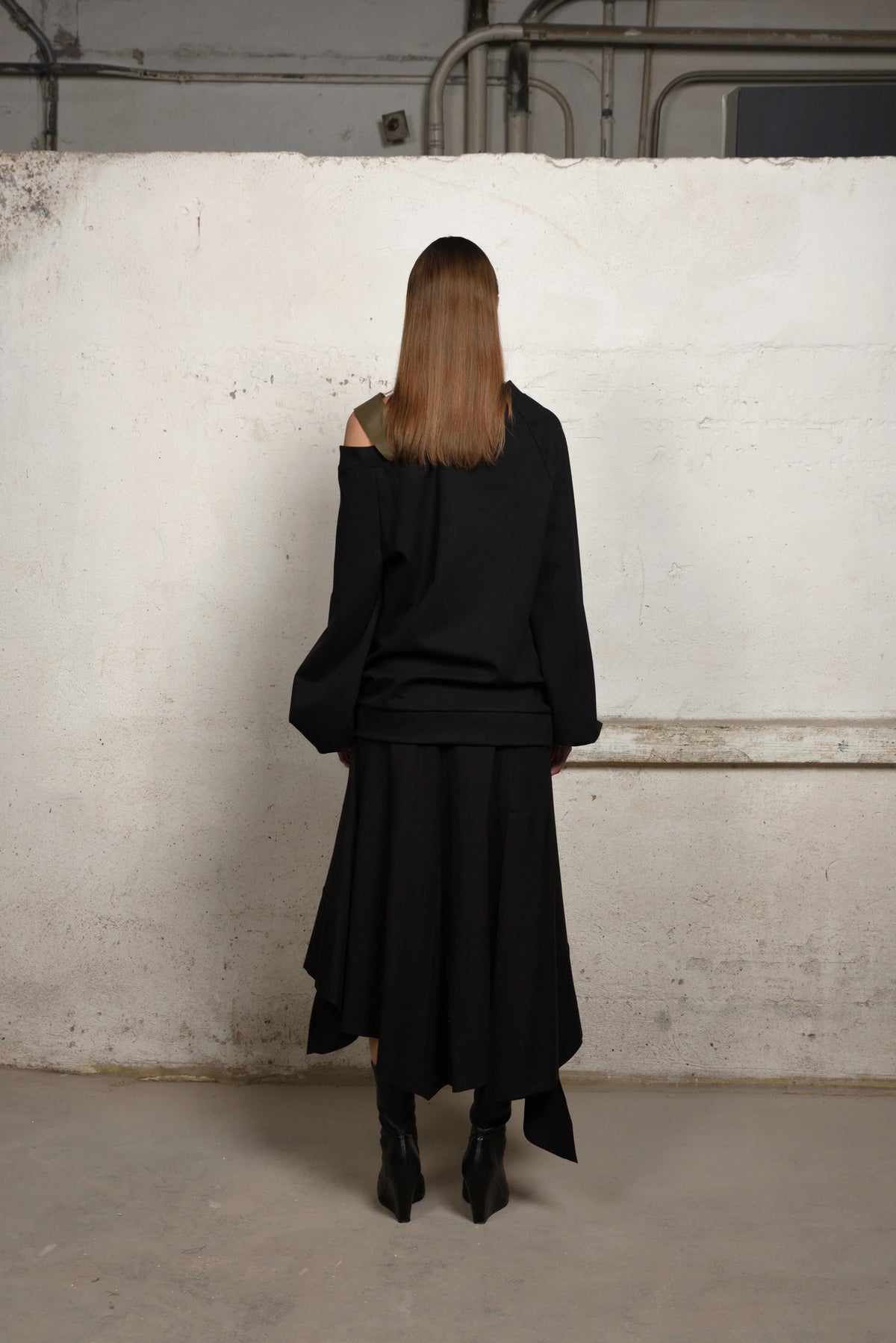 Stylish asymmetrical sweater by SIMPLY MILA, modern women's jumper with unique design and soft knit fabric, front view.
