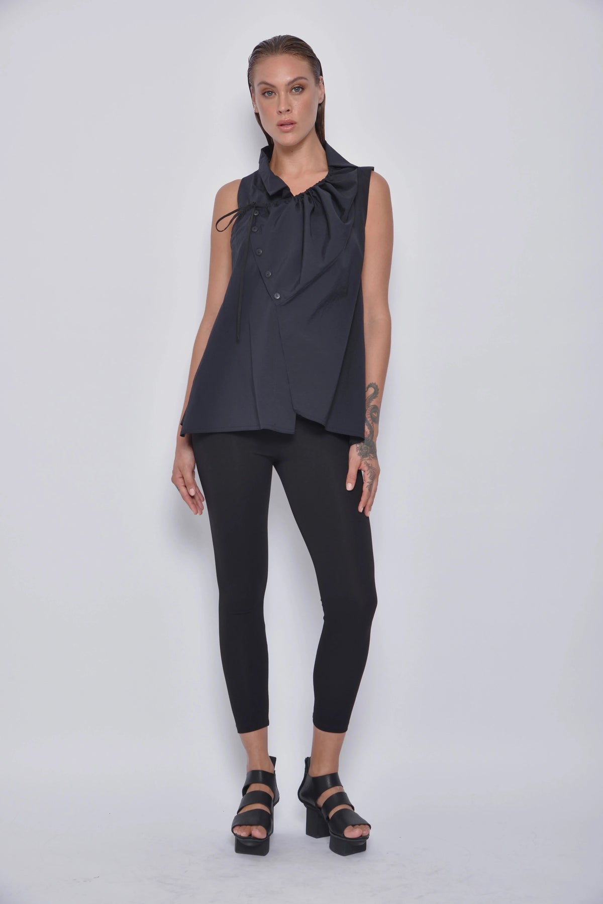 Front view of a stylish Astra Top by SIMPLY MILA, a modern women's clothing brand, featuring its fit and fabric details.