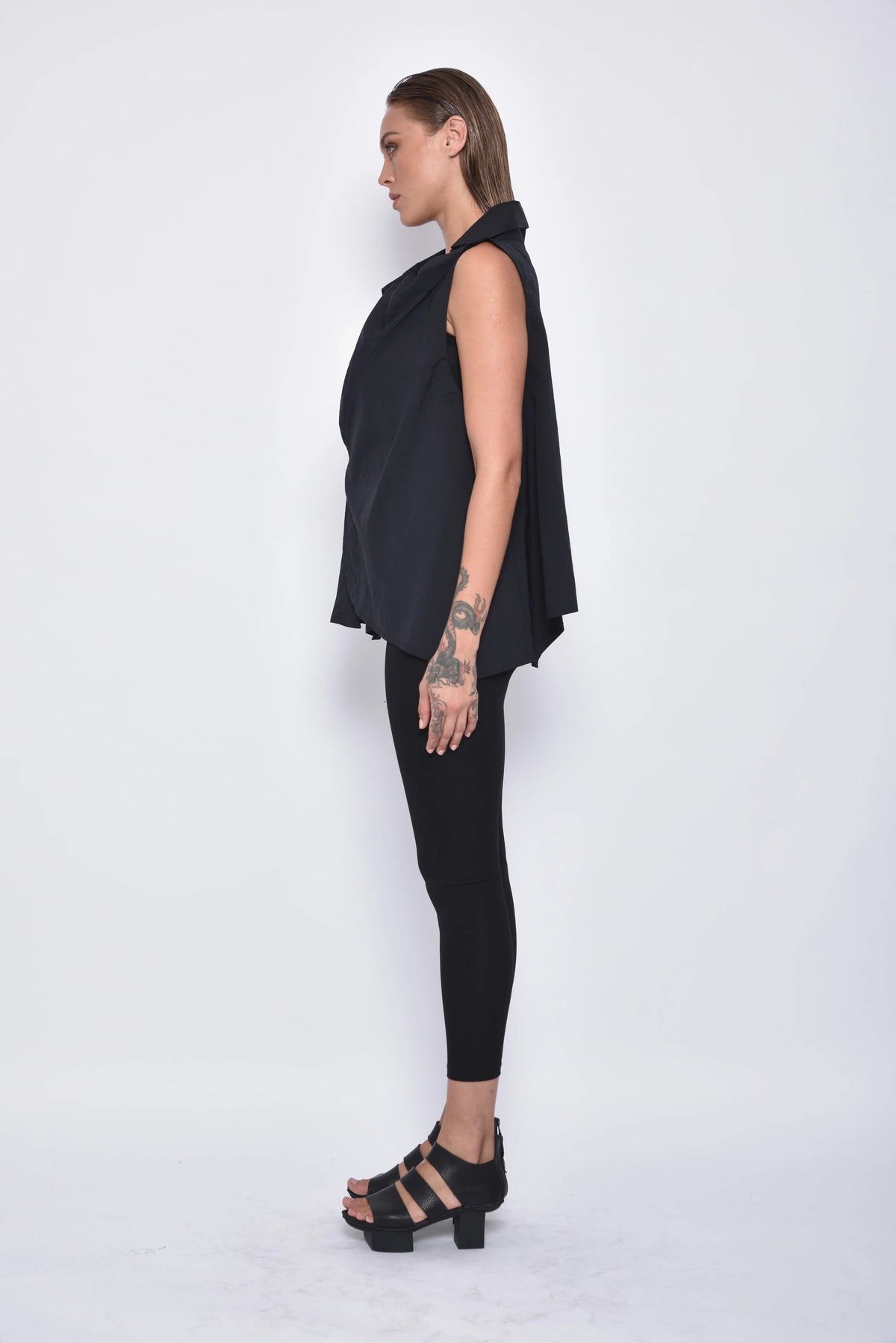 Simply Mila Astra Top, a stylish women's blouse in a side view showing its modern design and comfortable fit.