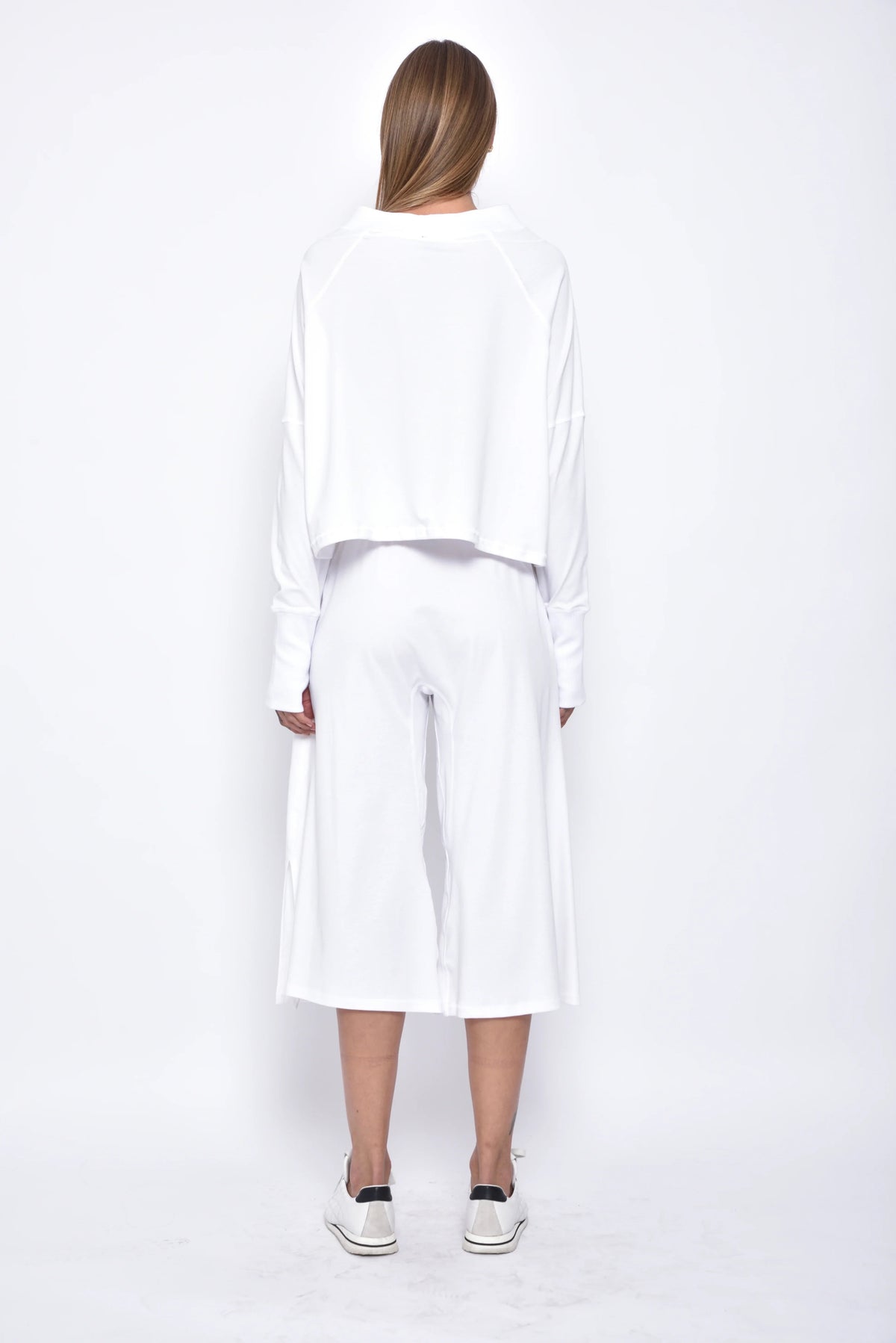 Back view of a SIMPLY MILA Zoe top, a modern women's clothing blouse with stylish design and comfortable fit.