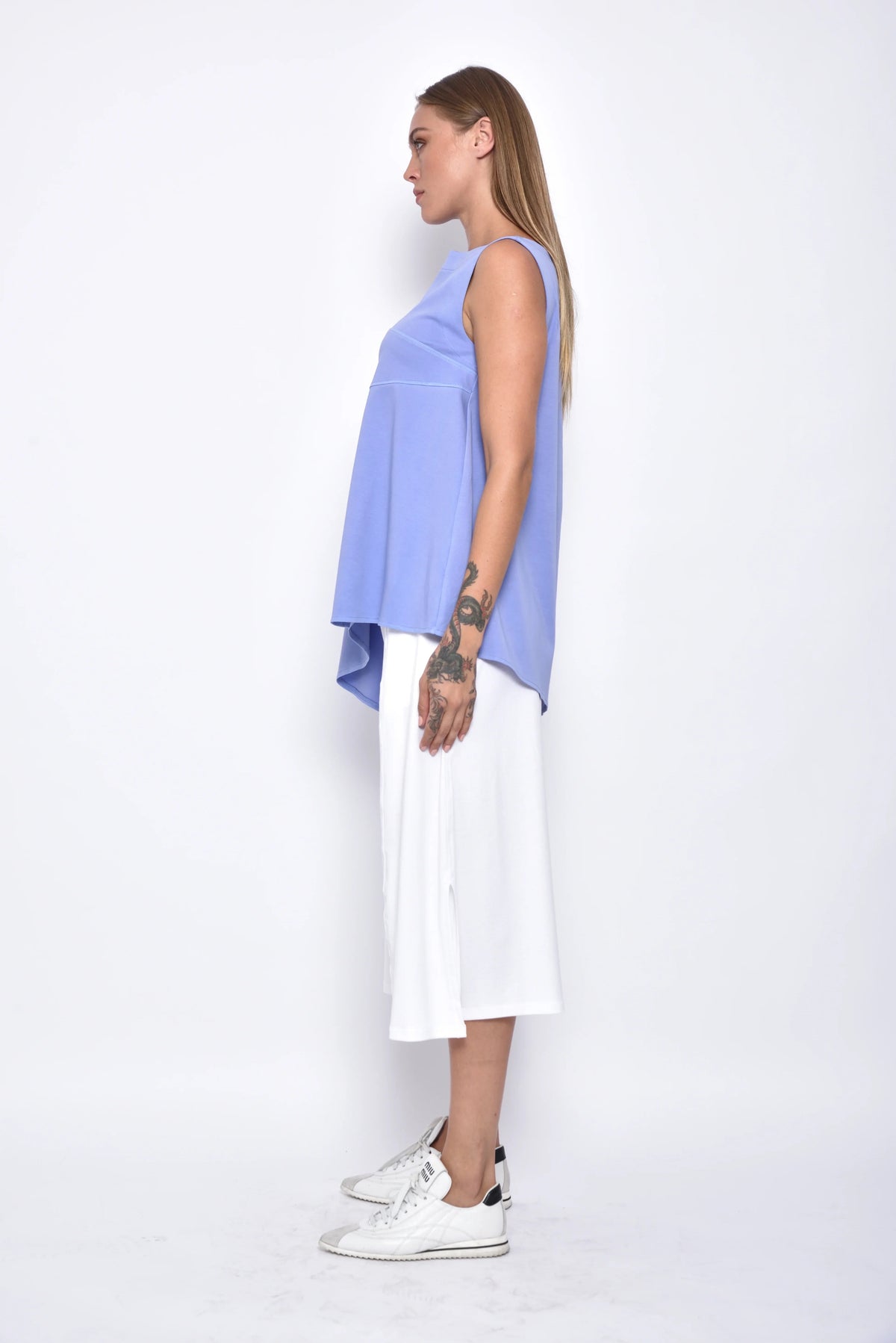 Side view of the Tessa Top by SIMPLY MILA, a stylish women's blouse in soft fabric with a relaxed fit and modern design.