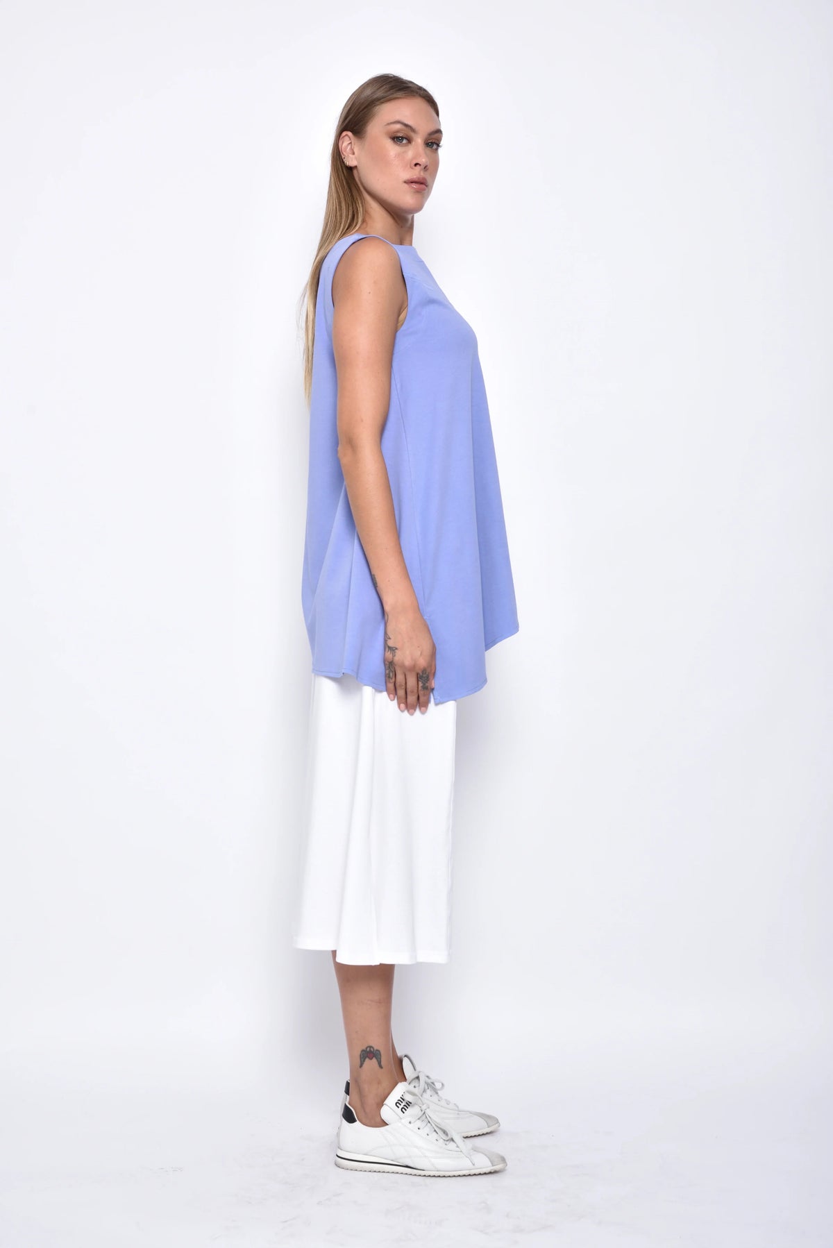 Side view of the Tessa Top by SIMPLY MILA, a modern women's blouse with a stylish and comfortable fit.