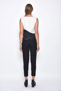 Back view of SIMPLY MILA modern women's uneven hem tank top in soft fabric, showcasing stylish asymmetrical hem detail.