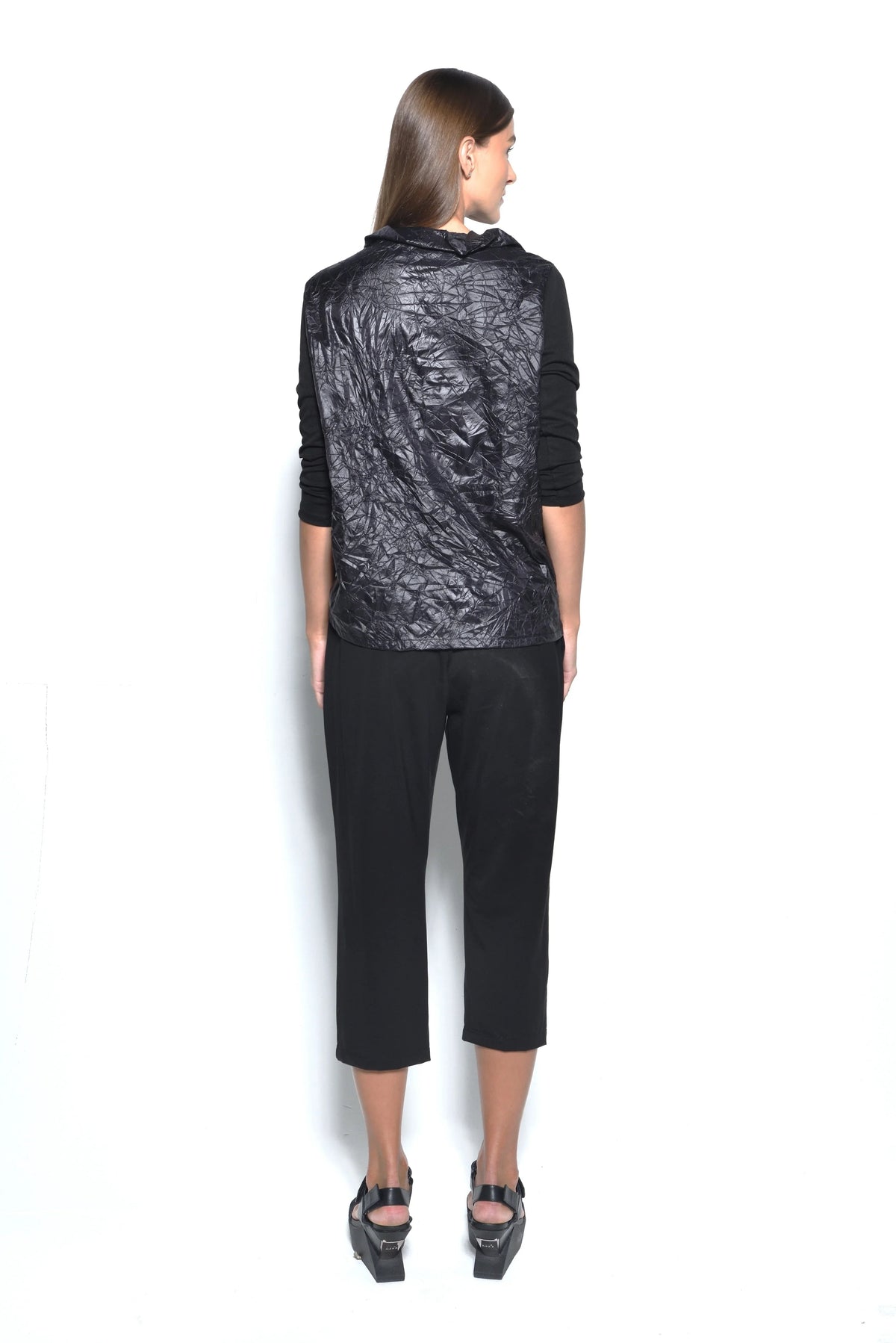 Back view of SIMPLY MILA Chloe Top, a stylish women's clothing top with a modern design, shown from behind.