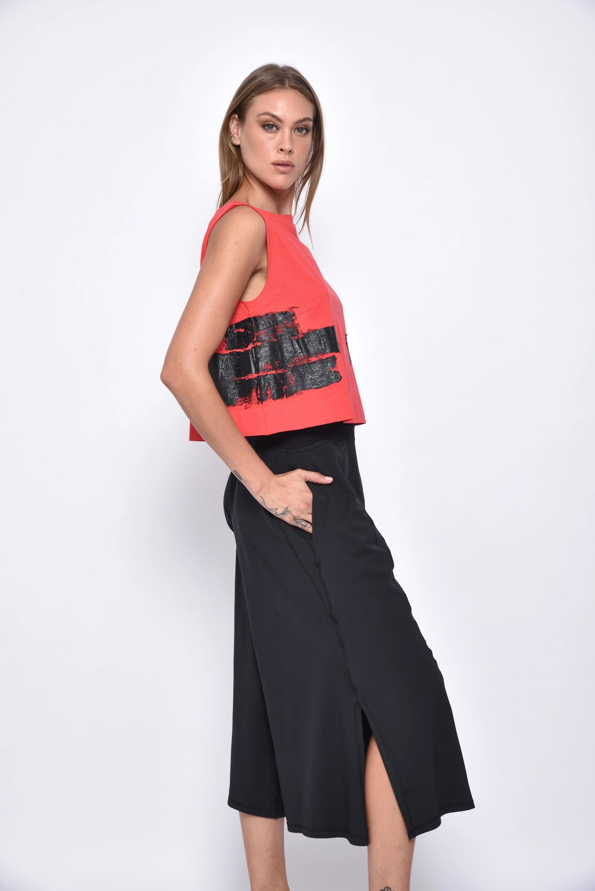 Light-colored Dido top from SIMPLY MILA Modern Women's Clothing, showing the stylish neckline and soft fabric details.