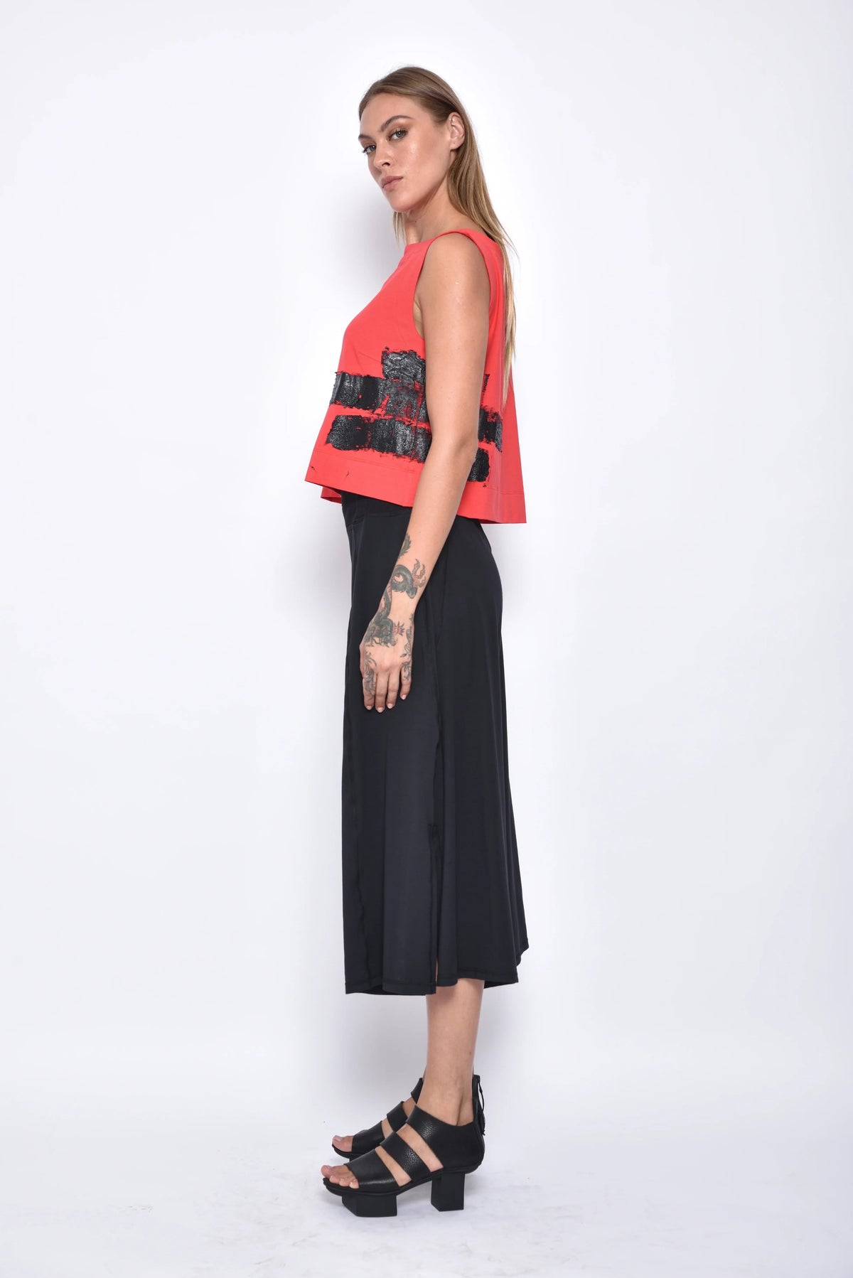Simply Mila Dido top, modern women's clothing with a stylish design, shown on a model in a close-up image.
