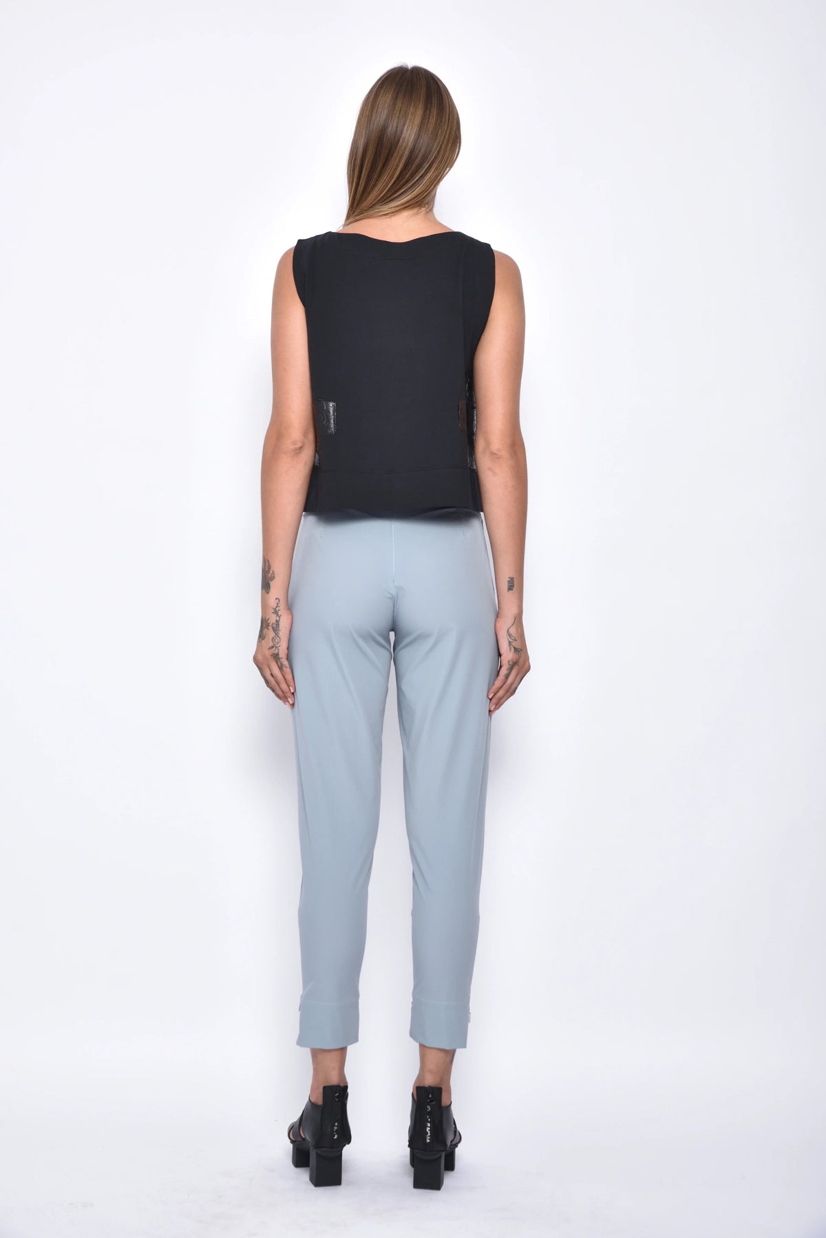 Simply Mila Dido top showing a stylish women's sleeveless blouse with a relaxed fit and modern design.