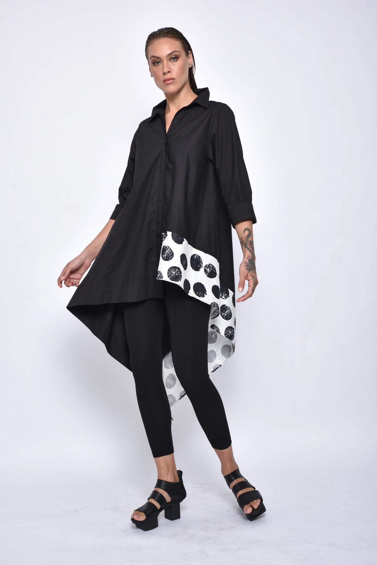 Asymmetrical tunic shirt from SIMPLY MILA, modern women's tops, featuring a stylish, flowy design and unique hemline.