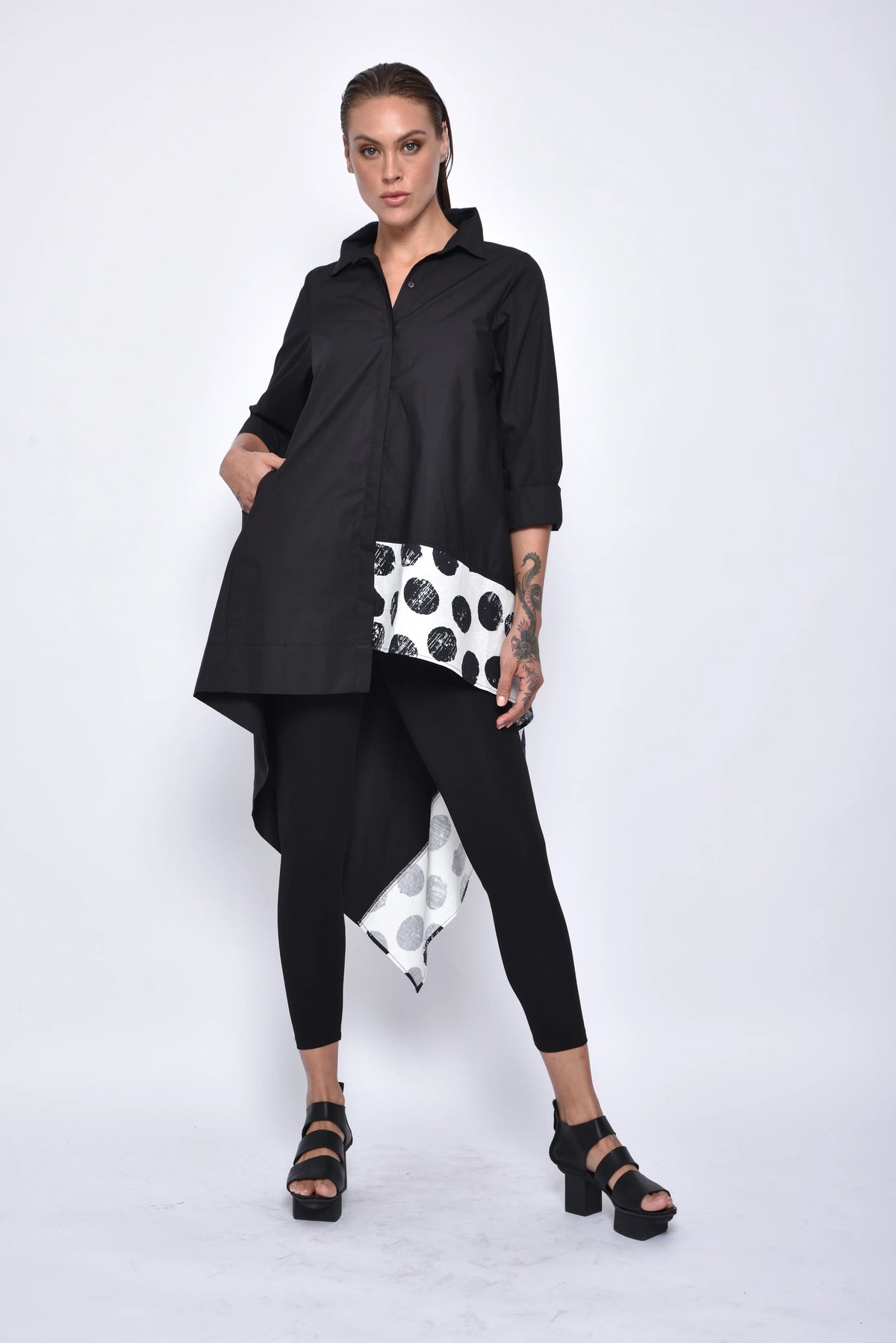 Asymmetrical tunic shirt from SIMPLY MILA, modern women's top with a stylish, uneven hem and relaxed fit, shown in the image.