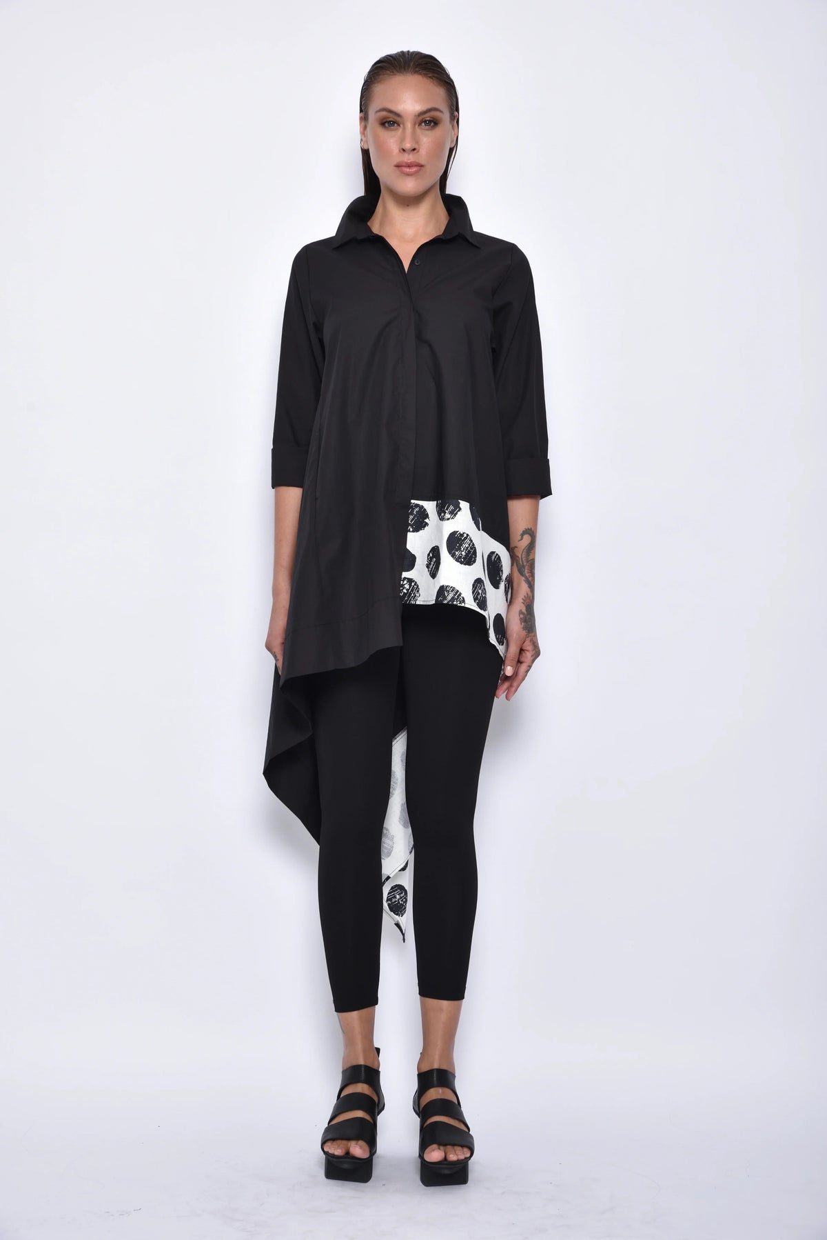 Front view of a stylish asymmetrical tunic shirt by SIMPLY MILA, featuring modern women's top with unique hemline and comfortable fit.