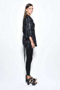Side view of a stylish Mykonos Tunic by SIMPLY MILA, a modern women's top with relaxed fit and lightweight fabric.
