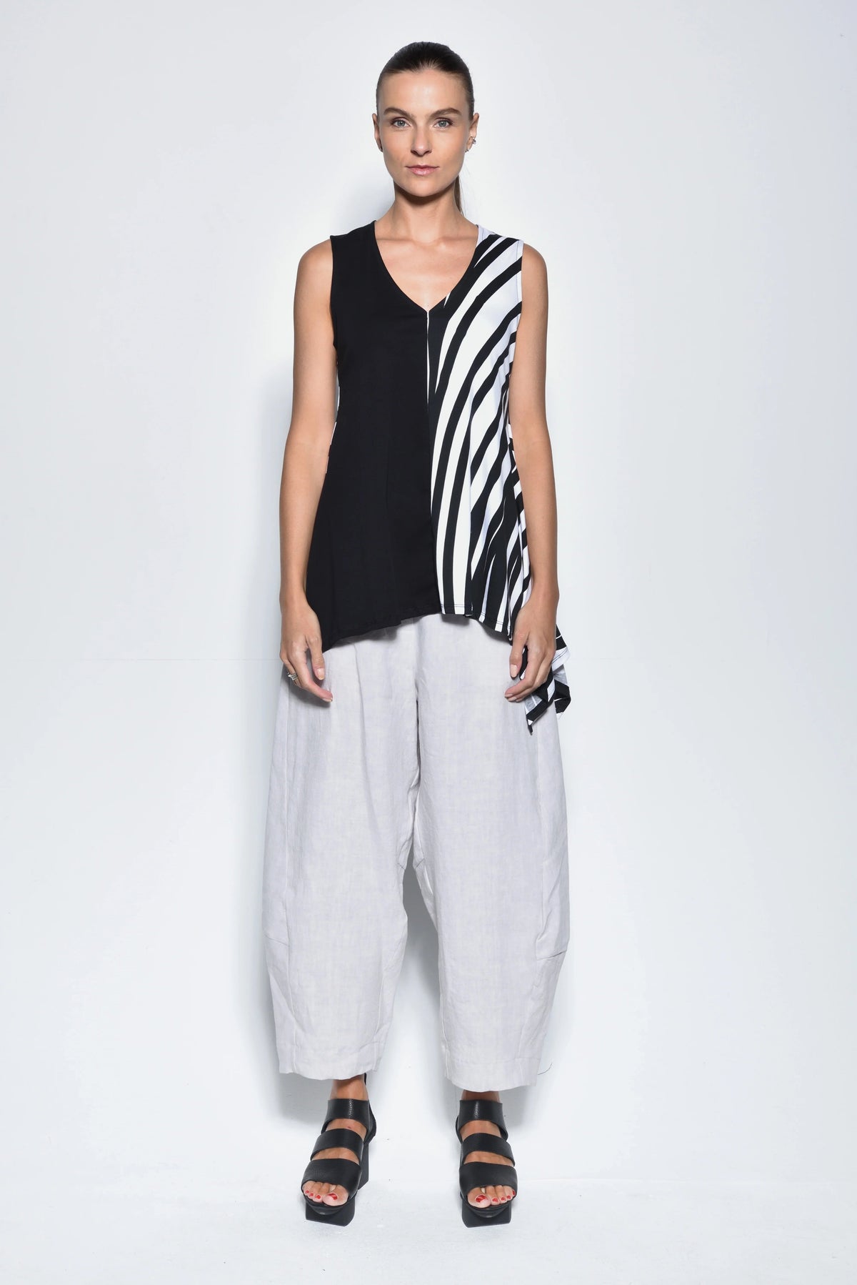Black Irene top by SIMPLY MILA, a modern women's clothing brand, featuring a stylish, fitted design with short sleeves.