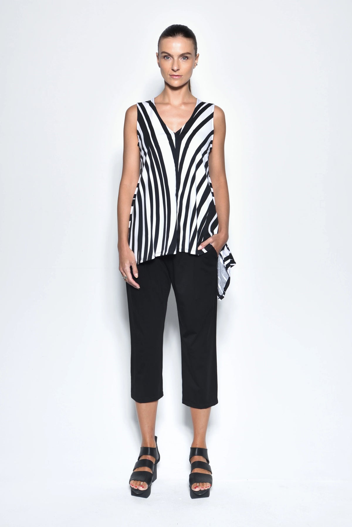 Simply Mila Irene top, modern women's sleeveless blouse with a spiral front design, casual stylish women's clothing.