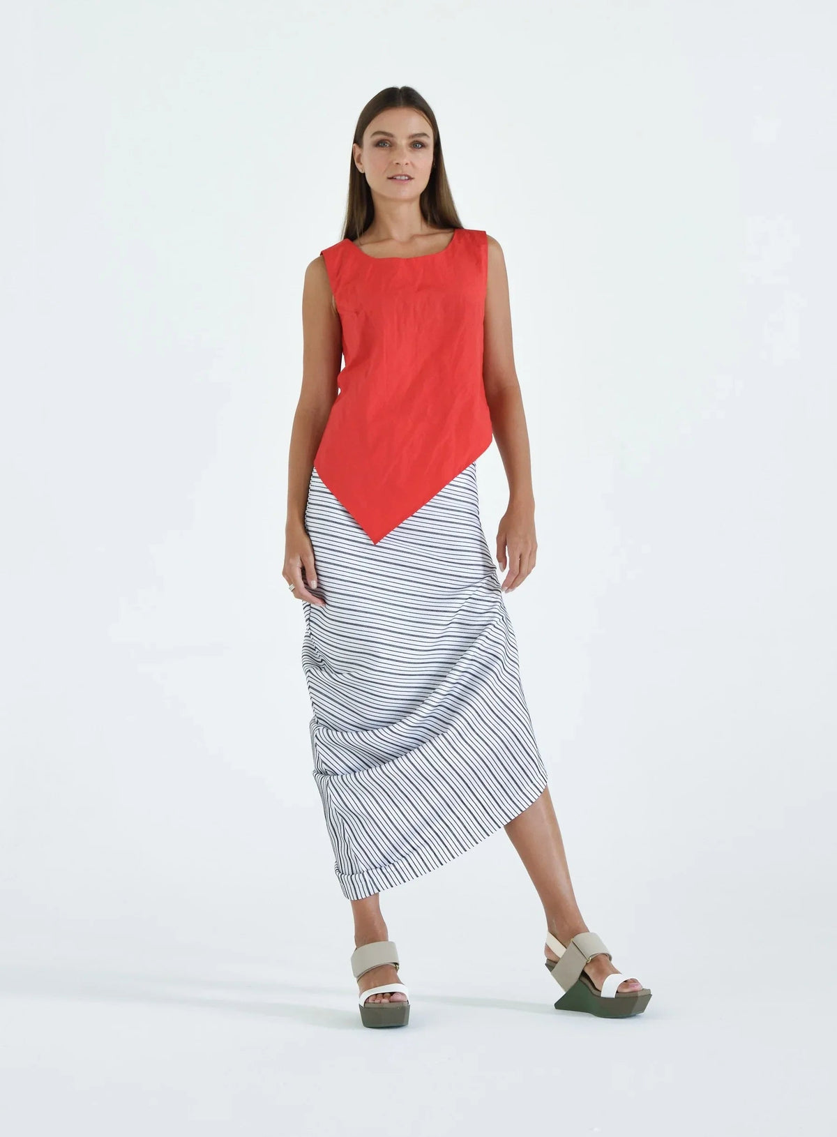 Red uneven hem tank top by SIMPLY MILA, modern women's sleeveless blouse with a stylish asymmetrical hem.