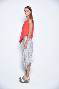 Red uneven hem tank top from SIMPLY MILA Modern Women's Clothing, showing a side view of the stylish, casual sleeveless top.