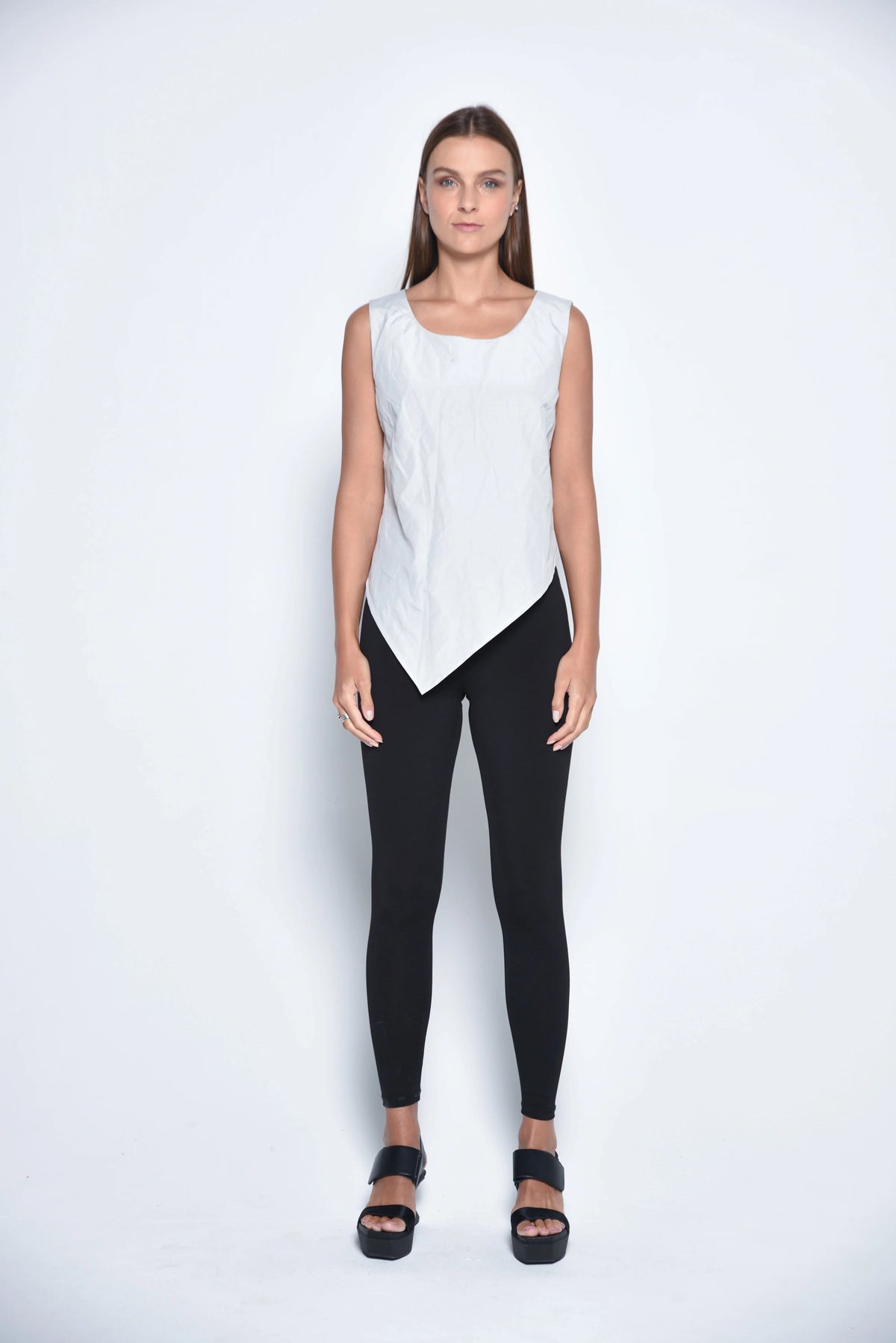Silver uneven hem tank top from SIMPLY MILA Modern Women's Clothing, front view showing stylish asymmetrical hem and sleeveless design.