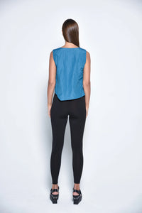 Black uneven hem tank top from SIMPLY MILA Modern Women's Clothing, featuring a stylish, relaxed fit and unique asymmetrical hem.