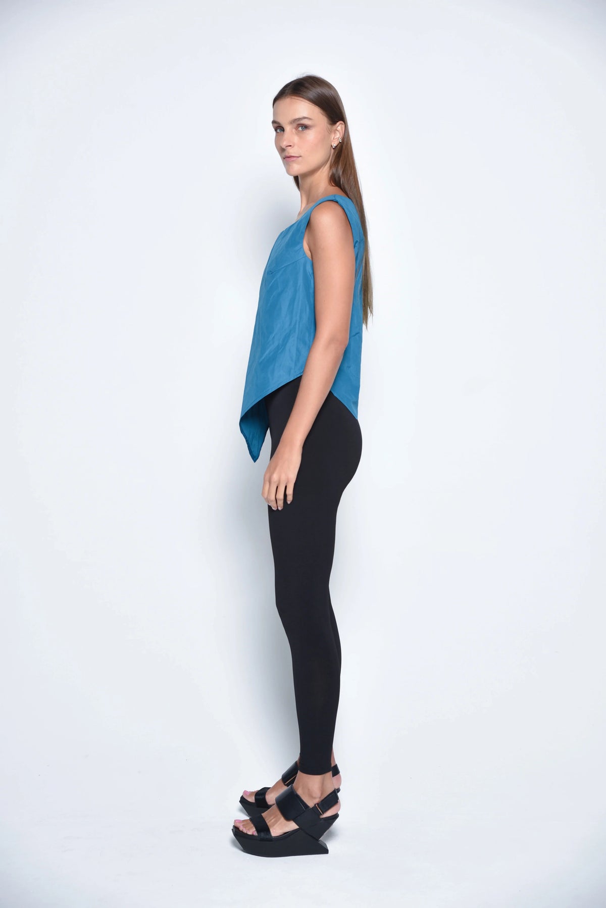 Black uneven hem tank top from SIMPLY MILA Modern Women's Clothing, showing a stylish sleeveless design with a relaxed fit.