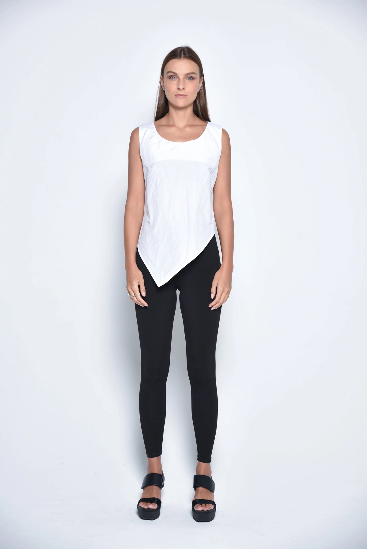 White uneven hem tank top by SIMPLY MILA, modern women's clothing, front view showcasing the stylish asymmetrical hem.