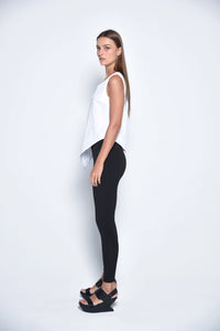 White uneven hem tank top by SIMPLY MILA, modern women's sleeveless tops with stylish asymmetrical hem detail.