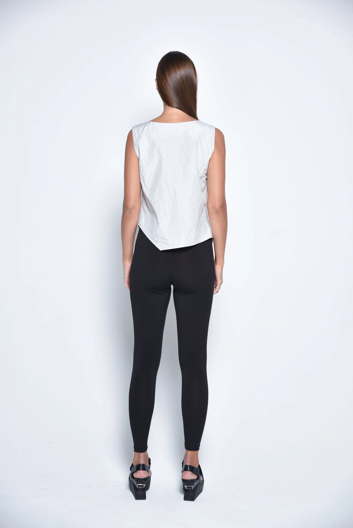 Silver uneven hem tank top from SIMPLY MILA Modern Women's Clothing, featuring a stylish asymmetric hem and sleeveless design.