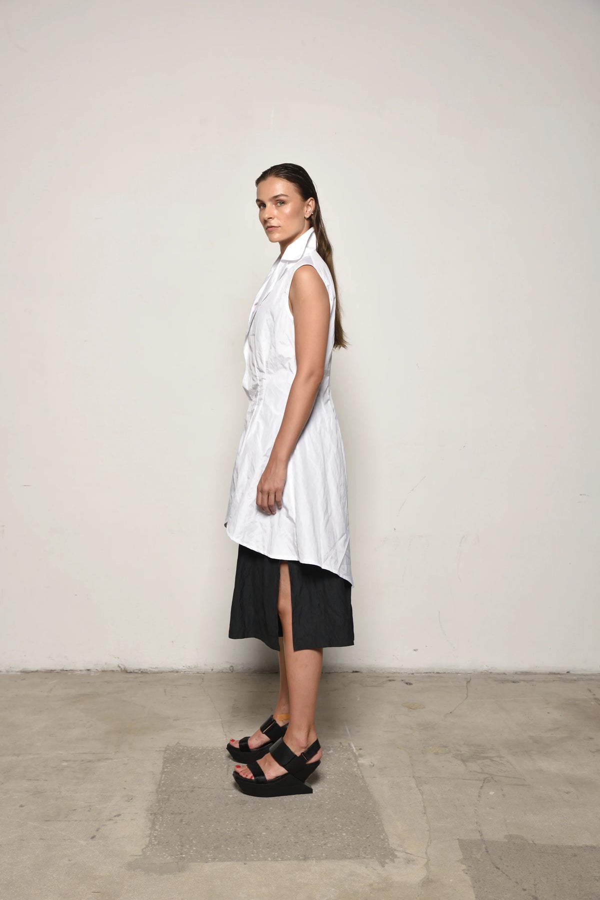 White Imperial Tunic by SIMPLY MILA, modern women's clothing, side view showcasing relaxed fit and stylish design.