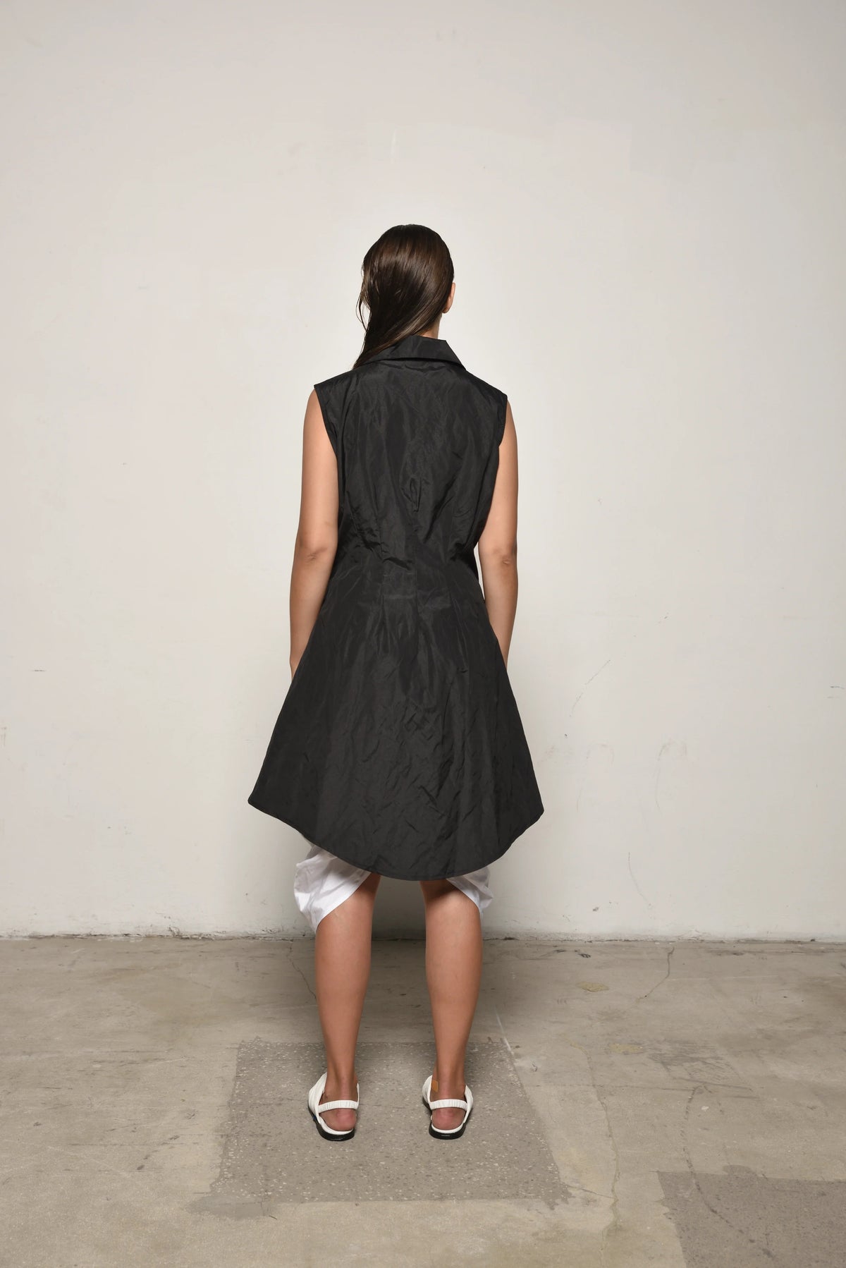 Back view of a black Imperial Tunic by SIMPLY MILA, a modern women's clothing top with a relaxed fit and stylish design.
