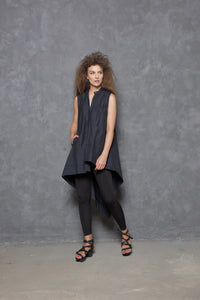 Sleeveless asymmetrical tunic shirt from SIMPLY MILA, featuring a modern design with uneven hem and stylish fit.