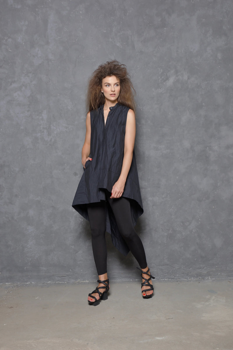 Sleeveless asymmetrical tunic shirt from SIMPLY MILA, featuring a modern design with uneven hem and stylish fit.