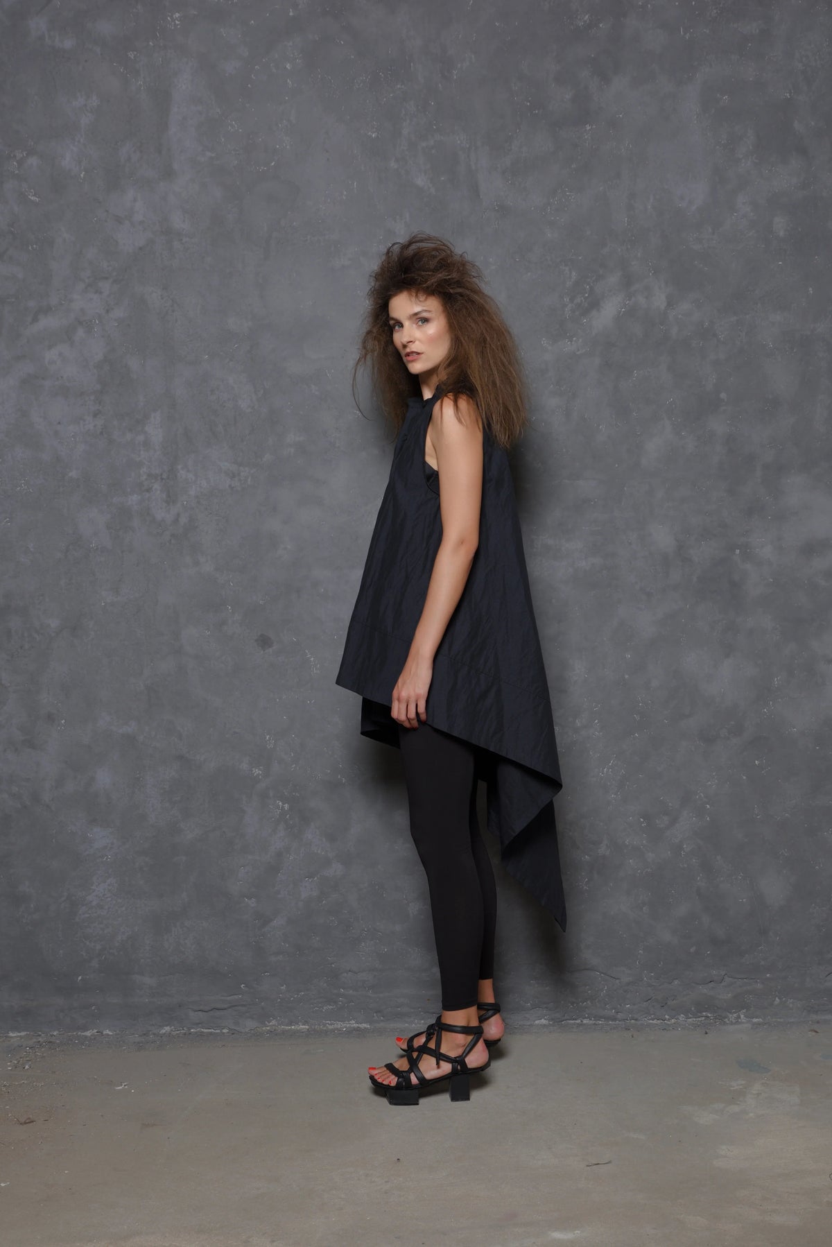 Sleeveless asymmetrical tunic shirt in lightweight fabric, styled with a relaxed fit, from SIMPLY MILA Modern Women's Clothing.