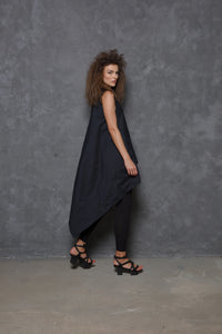 Sleeveless asymmetrical tunic shirt from SIMPLY MILA featuring a modern design, flowy fabric, and stylish silhouette.