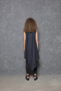 Sleeveless asymmetrical tunic shirt from SIMPLY MILA, featuring a modern design with flowing fabric and unique hemline.