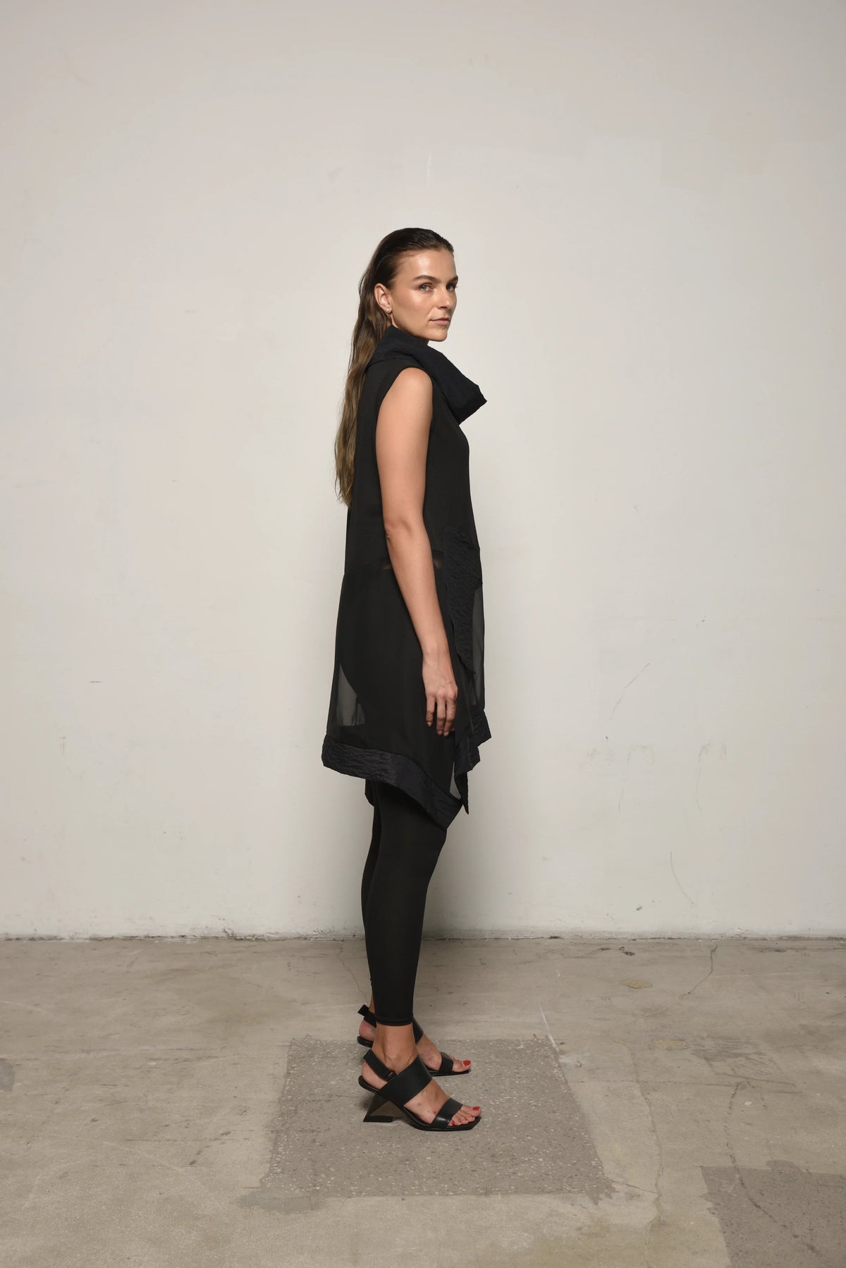 Side view of a sleeveless mix tunic from SIMPLY MILA, showcasing its relaxed fit and casual style for modern women's fashion.