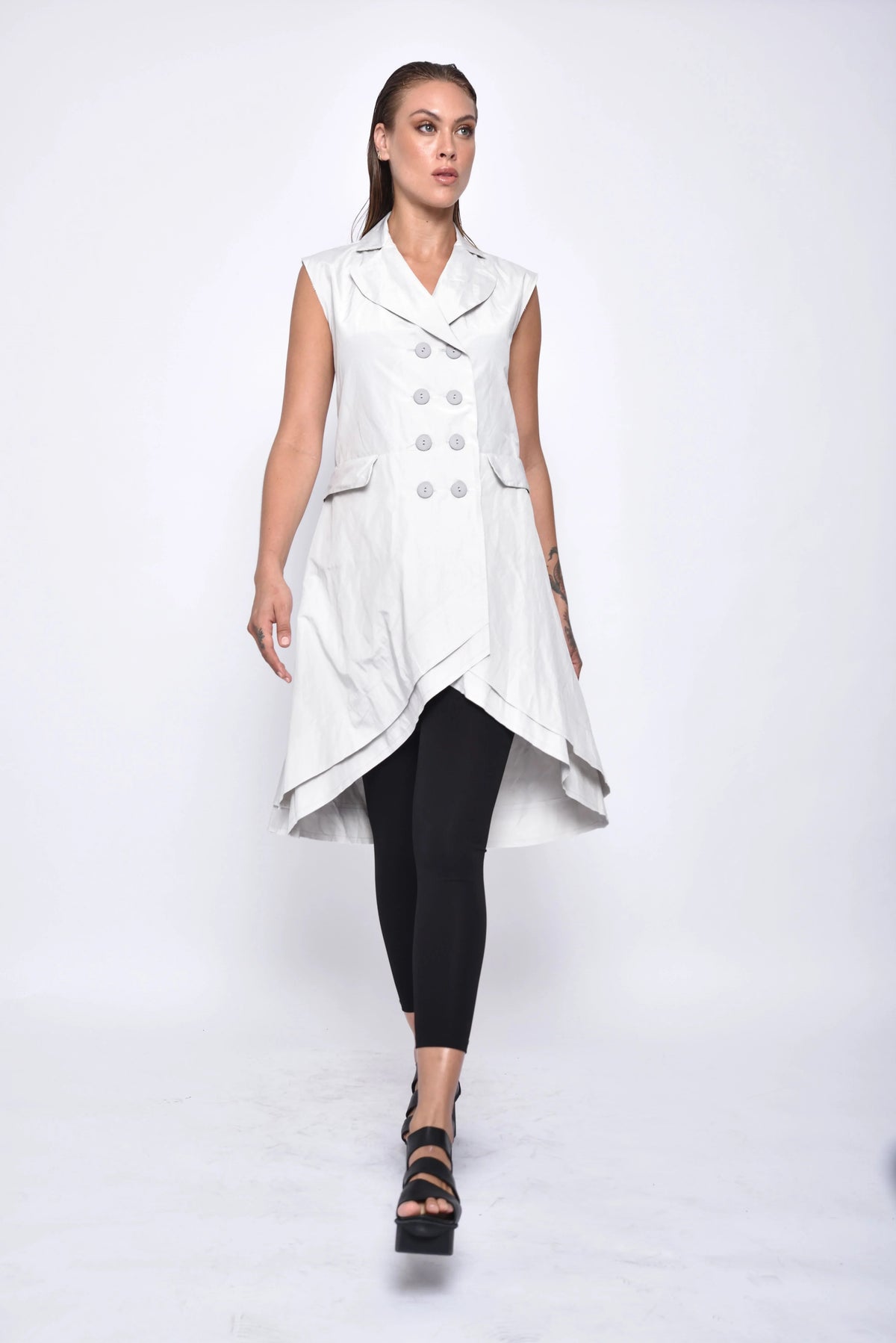 SIMPLY MILA modern women's tunic vest in neutral fabric, layered over a blouse, showcasing casual chic style.
