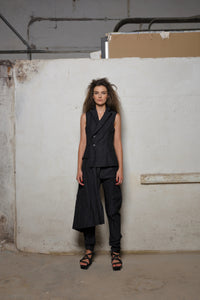 Front view of a stylish uneven vest by SIMPLY MILA Modern Women's Clothing, featuring a unique asymmetrical design.