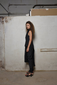 Side view of SIMPLY MILA modern women's uneven vest showing textured fabric and stylish asymmetrical design.