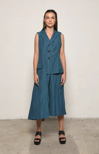 INK-colored uneven vest by SIMPLY MILA, modern women's clothing, showing front view with asymmetrical hem and textured fabric.