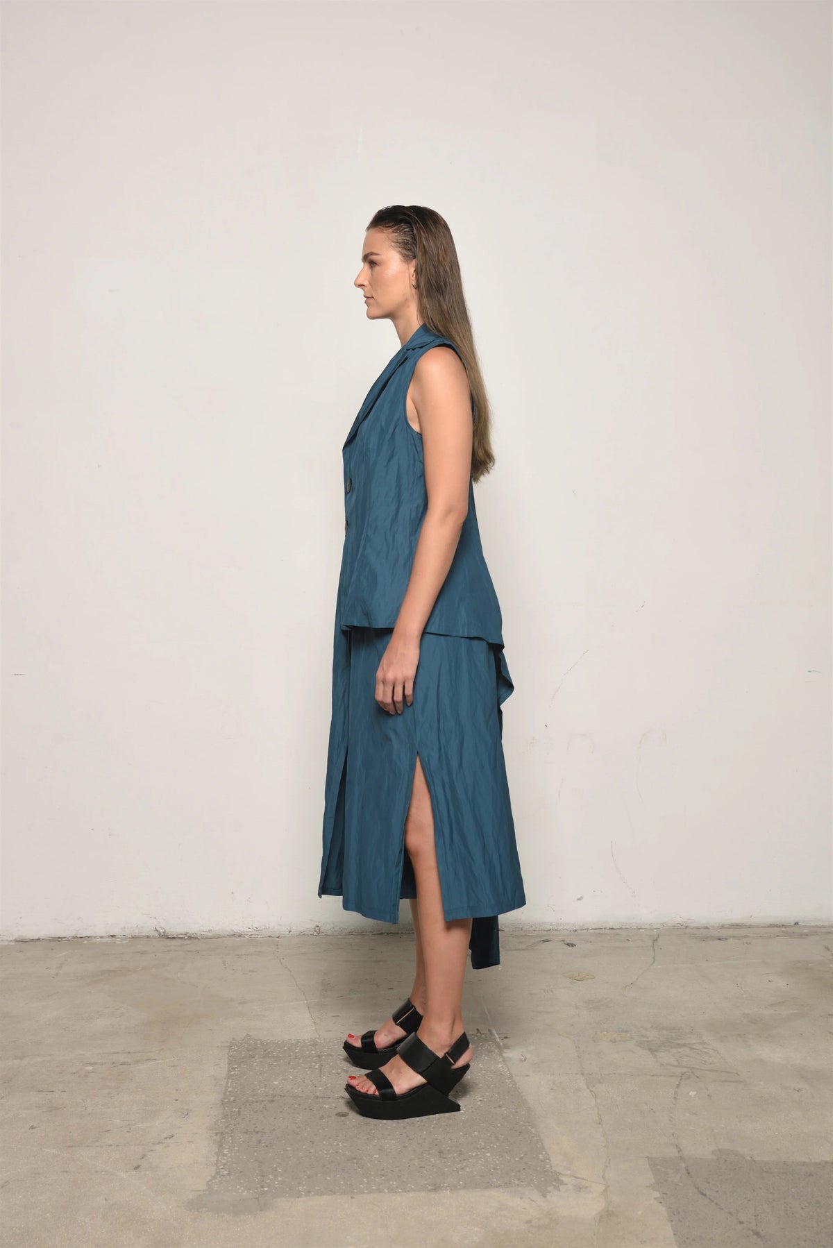 Ink-colored uneven vest by SIMPLY MILA Modern Women's Clothing, featuring a stylish asymmetrical design.