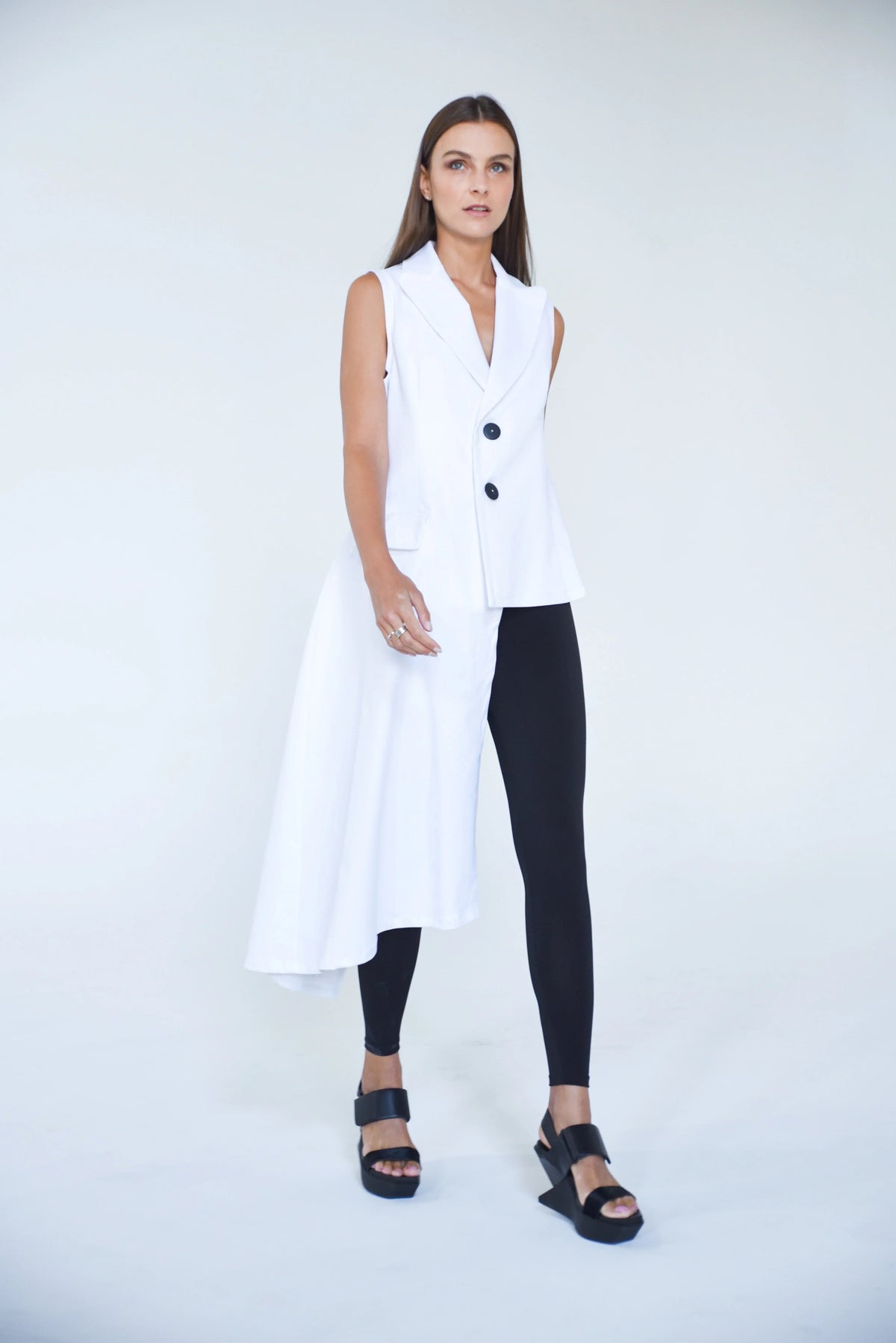 Uneven vest from SIMPLY MILA Modern Women's Clothing featuring a stylish, asymmetrical design and textured fabric.