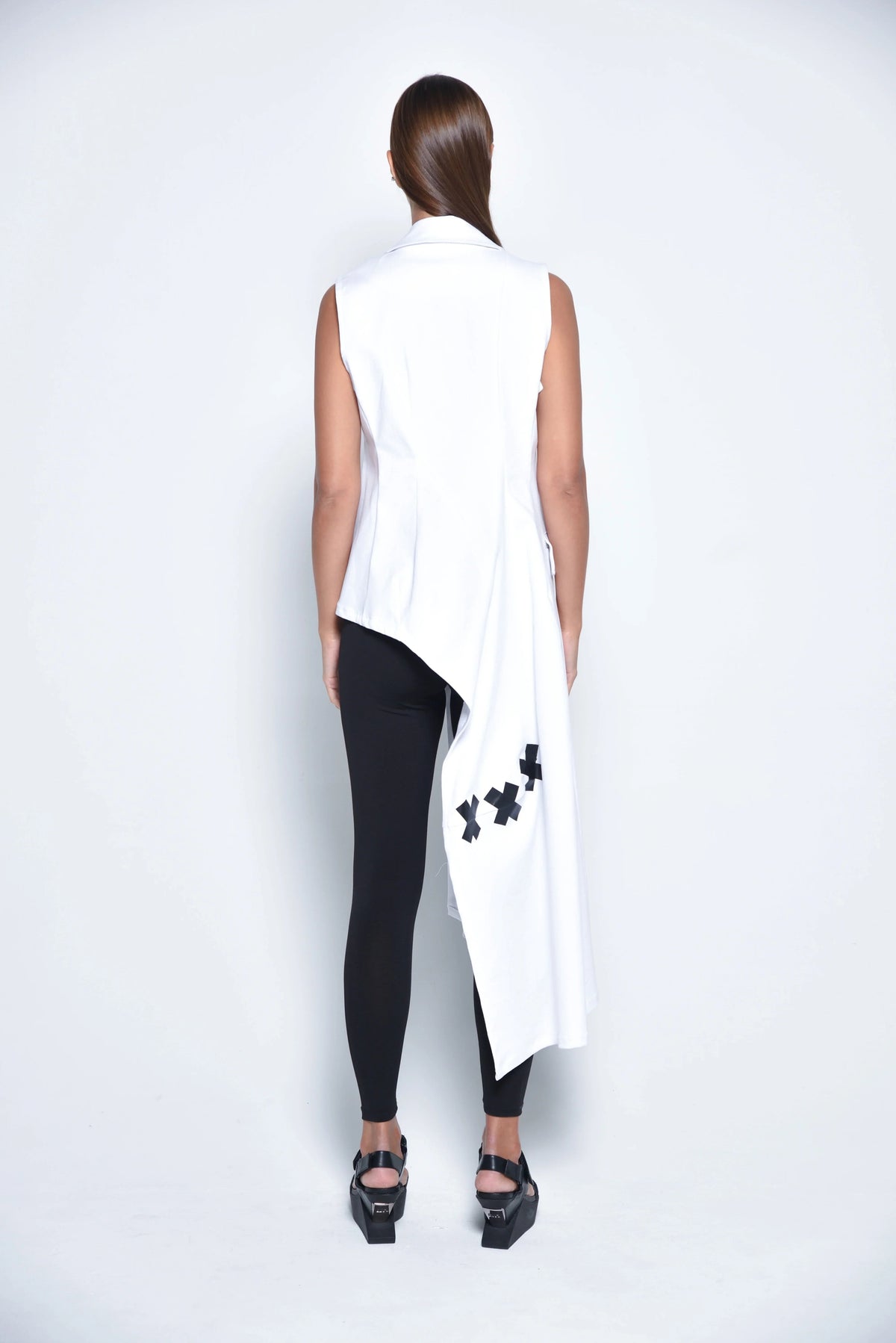 Back view of a SIMPLY MILA Modern Women's Clothing uneven vest in textured fabric, showcasing its asymmetrical design.