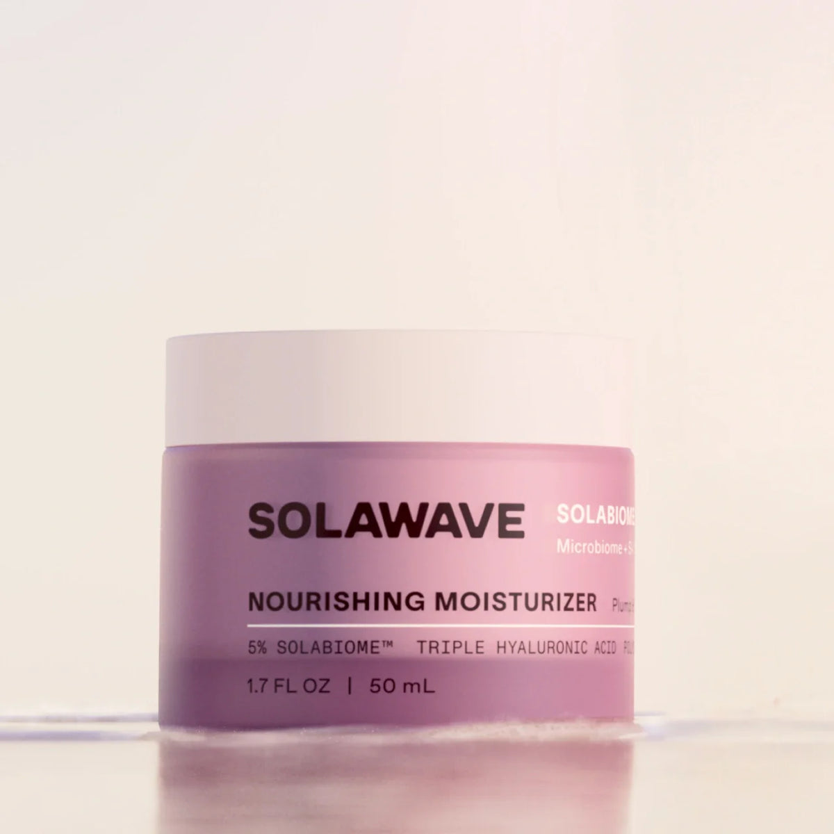Solawave Pre- & Probiotic Nourishing Moisturizer in a sleek jar, showing its creamy texture designed for skin hydration and care.
