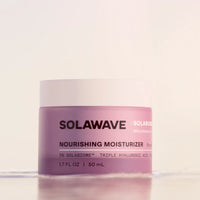 Solawave Pre- & Probiotic Nourishing Moisturizer in a sleek jar, showing its creamy texture designed for skin hydration and care.