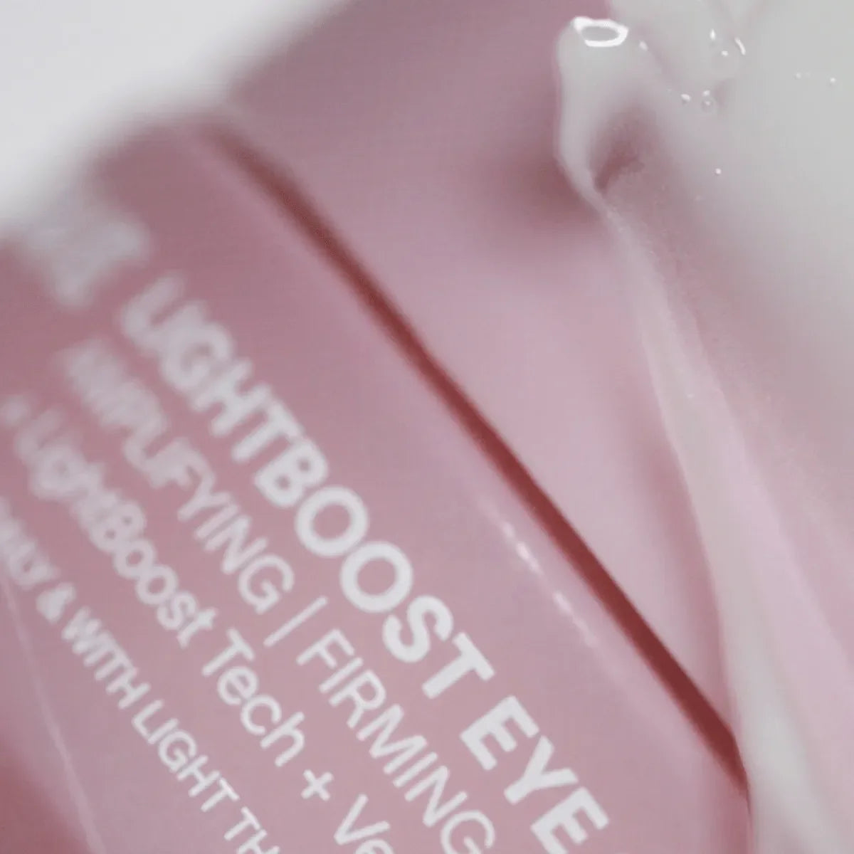Solawave Light Therapy Boosting Eye Cream in a sleek white jar, designed to reduce puffiness and brighten the eye area.